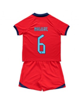 Otroški Nogometna dresi replika Anglija Harry Maguire #6 Gostujoči SP 2022 Kratek rokav (+ hlače)